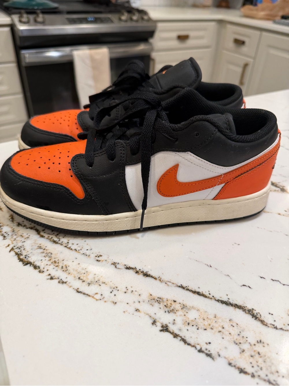 Nike youth Air Jordan’s in Black/Orange/White